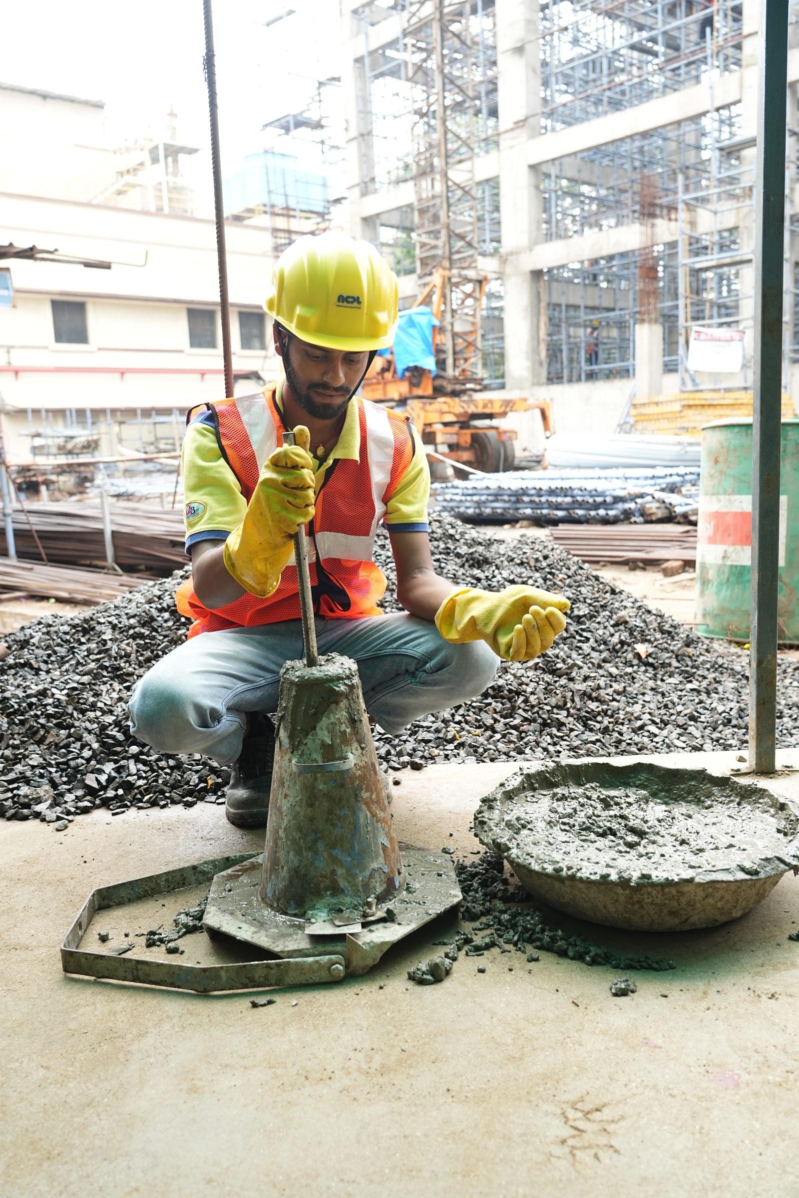 NCPL engineer carrying out a slump test on fresh concrete